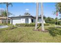 Updated single story home with a two car garage and landscaped lawn at 8209 Rugby Ct, Hudson, FL 34667