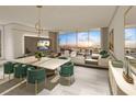 Elegant dining area with water views and modern decor at 5701 Bowen Daniel Dr. # 402, Tampa, FL 33616