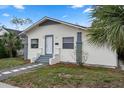 Newly remodeled home with a front porch and stone pathway at 1100 Melrose S Ave, St Petersburg, FL 33705