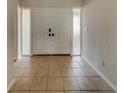 Bright entryway with tiled floors and double doors leading to the main living areas at 1803 Southwood Ln, Clearwater, FL 33764