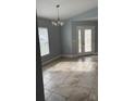 Bright dining room with tile floors and a chandelier at 18229 Port Side St, Tampa, FL 33647