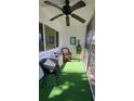 Relaxing screened porch with wicker furniture and artificial turf at 2348 Shelley St # 4, Clearwater, FL 33765