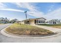 Charming single-story home featuring a well-manicured lawn, long driveway and lovely curb appeal at 35934 Verano Ln, Zephyrhills, FL 33541