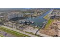 Aerial view of a waterfront condo with a marina, boat docks, and parking at 4939 Floramar Ter # 501, New Port Richey, FL 34652