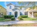 Charming two-story home with manicured landscaping and a welcoming entrance at 13419 Lake Monroe Pl, Riverview, FL 33579