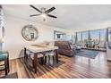 Bright condo dining area with a table and chairs, hardwood floors, and large windows at 2616 Cove Cay Dr # 503, Clearwater, FL 33760