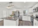 Modern kitchen with stainless steel appliances and granite countertops at 4916 Carlyle Rd, Tampa, FL 33615