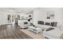 Bright living room featuring a sectional sofa and stylish coffee table at 4916 Carlyle Rd, Tampa, FL 33615