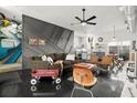 Stylish condo with artistic flair in the living room with concrete floors and open floor plan at 855 3Rd N Ave, St Petersburg, FL 33701