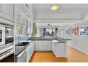 Modern kitchen with stainless steel appliances, granite countertops, and stylish backsplash at 226 5Th N Ave # 1502, St Petersburg, FL 33701