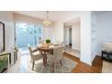 Charming dining area with wood table, seating for four, and natural light at 11805 Northtrail Ave, Temple Terrace, FL 33617
