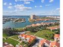 An aerial view showcases the desirable waterfront community with stunning water views and beautiful landscaping at 21 Crescent S Pl, St Petersburg, FL 33711