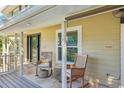 Comfortable back porch with seating and a serene outdoor view, perfect for relaxation and enjoying quiet moments at 13945 75Th Ave, Seminole, FL 33776