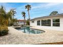 Backyard oasis with a lovely in-ground pool and jacuzzi, perfect for entertaining at 5321 Dover Ne St, St Petersburg, FL 33703