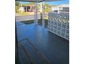 Concrete-floored porch with lattice work and a view of neighborhood street at 27466 Us Highway 19 N # 97, Clearwater, FL 33761