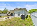 Nice backyard featuring a fire pit, a small patio, a fenced yard and an A/C unit at 3611 19Th N St, St Petersburg, FL 33713