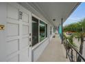 Exterior of a multi-unit dwelling with a long balcony and unit number 1211 at 4140 55Th N St # 1211, Kenneth City, FL 33709