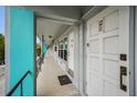 Exterior of a multi-unit dwelling with unit number 1210 on a long balcony at 4140 55Th N St # 1211, Kenneth City, FL 33709