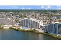 Beautiful aerial view of waterfront condo with a pool and a stunning view at 6009 Sea Ranch Dr # 303, Hudson, FL 34667