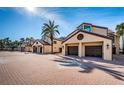 Charming townhome featuring private 2-car garage, neutral stucco exterior and meticulously landscaped yard at 732 Pinellas Bayway S, Tierra Verde, FL 33715