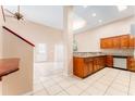 Bright kitchen with granite countertops and stainless steel appliances at 9406 Citrus Glen Pl, Tampa, FL 33618