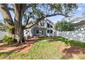 Charming home with a spacious backyard and a beautiful mature tree providing ample shade at 3616 W Morrison Ave, Tampa, FL 33629