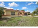 Well-manicured lawn and landscaping enhance the curb appeal of this charming single-Gathering home at 10412 Ireland St, Spring Hill, FL 34608
