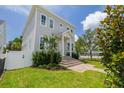 Two-story home with lush lawn and mature landscaping at 100 37Th Ne Ave, St Petersburg, FL 33704