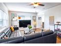 Comfortable living room featuring a large leather sectional, modern decor, and plenty of natural light at 1926 Burlington N Ave, St Petersburg, FL 33713