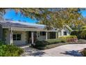 Inviting home with a covered porch, seating, and well-maintained landscaping at 6723 Mango S Ave, St Petersburg, FL 33707