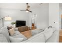 Comfortable living room featuring a large sectional sofa, ceiling fan, and wood-look flooring at 7001 Interbay Blvd # 313, Tampa, FL 33616