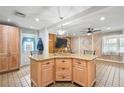 Kitchen island with a granite countertop, cabinetry, and an overhead light fixture at 6327 2Nd S Ave, St Petersburg, FL 33707