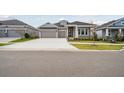 Charming single-Gathering home with a spacious driveway and meticulously manicured lawn at 6123 Hidden Branch Dr, Apollo Beach, FL 33572