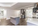 Open floorplan view of the kitchen showing the bathroom and the kitchen island at 3721 9Th S Ave, St Petersburg, FL 33711