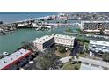 Beautiful waterfront condo with boat docks, close proximity to the beach, and ample parking at 12500 Capri Cir N # 302, Treasure Island, FL 33706