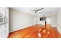 Bright living room with hardwood floors, ceiling fan, and view to a kitchen at 700 S Harbour Island Blvd # 226, Tampa, FL 33602