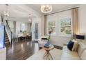 This living room showcases elegant décor, plantation shutters, and an open layout leading to the dining area at 7876 Marsh Pointe Dr, Tampa, FL 33635