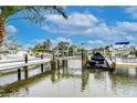 Scenic waterfront view with multiple boat slips and boats docked on a sunny day at 300 Venetian Dr # 7, Clearwater, FL 33755