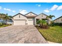 Charming single-Gathering home featuring a paved driveway and two-car garage at 19891 Bridgetown Loop, Venice, FL 34293