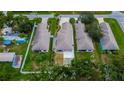Bird's eye view shows a residential neighborhood with fenced yards, manicured lawns, and mature trees at 3369 Houle Ave, Sarasota, FL 34232