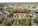 An aerial view highlights the property's location within a well-developed residential community surrounded by trees at 8907 Casablanca Way, Tampa, FL 33626