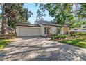Charming single-story home with a two-car garage and an inviting brick paved driveway at 4822 W San Miguel St, Tampa, FL 33629