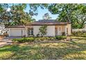Lovely single-Gathering home with well-maintained landscaping and a two-car garage at 4822 W San Miguel St, Tampa, FL 33629
