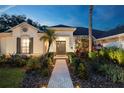 Attractive single-Gathering home featuring a well-kept lawn, lush landscaping, and a welcoming front entrance at 6020 Kestrel Point Ave, Lithia, FL 33547