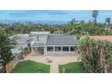 Beautiful home boasts a large outdoor patio, a charming balcony, and lovely backyard space at 1022 Canal St, Ruskin, FL 33570