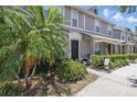 Beautiful townhome exterior with lush landscaping, well-manicured walkway, and inviting front entrance at 8856 Christie Dr # 0, Largo, FL 33771