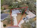 An aerial view of a single-story home with a large yard and driveway at 11592 110Th Ter, Seminole, FL 33778