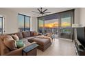 Modern living room with floor-to-ceiling windows offering city views and comfortable seating at 301 1St S St # 2006, St Petersburg, FL 33701