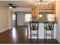 Open kitchen with stainless steel appliances and breakfast bar with seating at 9705 45Th N Way, Pinellas Park, FL 33782