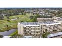Enjoy lovely golf course views from this pristine condo community with a building that features assigned covered parking at 225 Country Club Dr # 1611, Largo, FL 33771